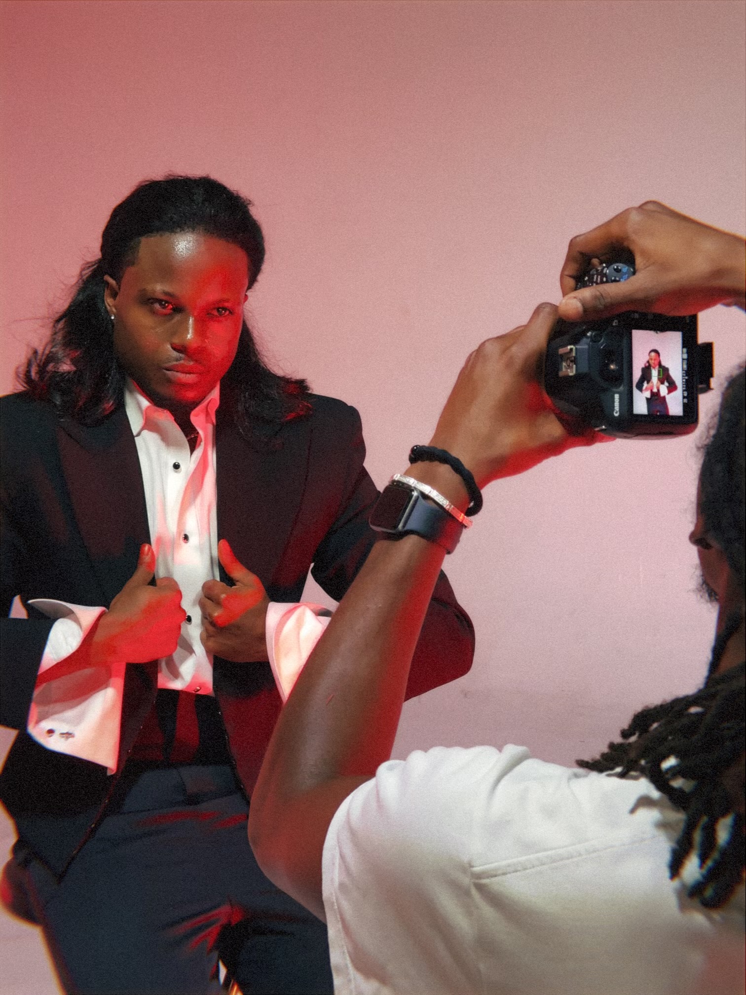 A photographer capturing TERRANCE DEAN during a portrait session