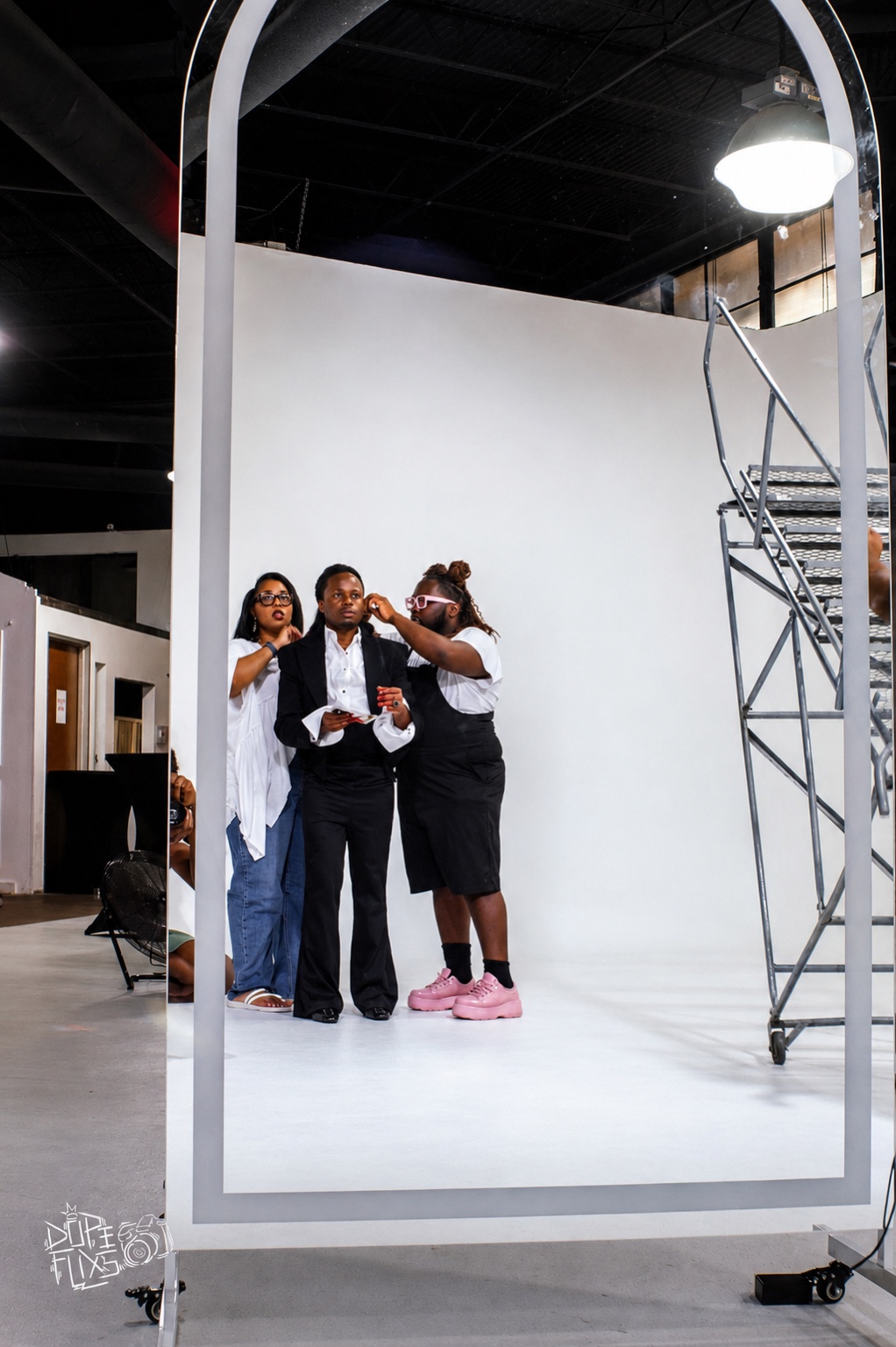 TERRANCE DEAN and collaborators preparing a portrait on a studio set